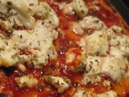 Pizza with goat cheese, and honey in the bush