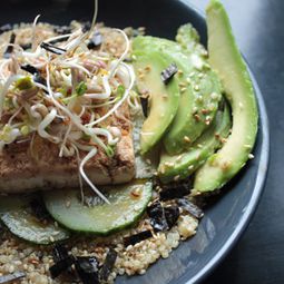 Bowl of Quinoa with tofu, avocado and cucumber, sesame-ginger sauce
