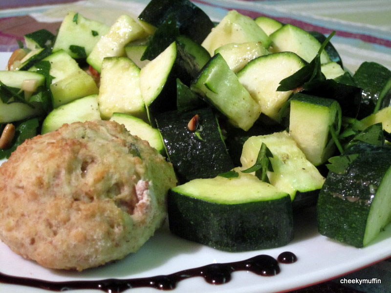 Baked zucchini vinaigrette with parsley and pine nuts