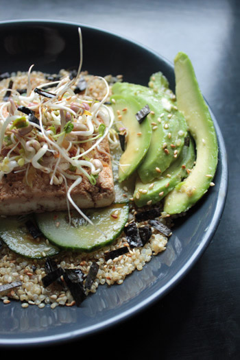 Bowl of Quinoa with tofu, avocado and cucumber, sesame-ginger sauce