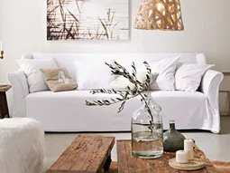 A wooden coffee table in the living room adds warmth and naturalness in