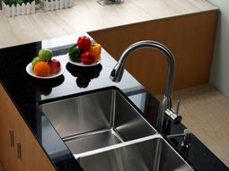 How should one choose the material of the sink in the kitchen