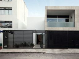 Minimalist house with an industrial touch in Canun, Mexico