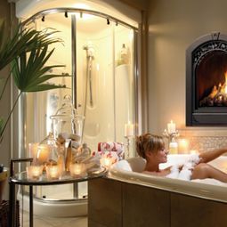 25 Bathroom designs with built-in fireplaces – romantic atmosphere