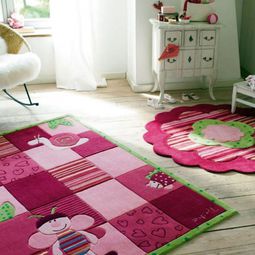 Beautiful designer carpet in the nursery of Esprit