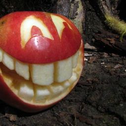 Decorative fruit carving – apple art and expressive faces