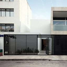 Minimalist house with an industrial touch in Canun, Mexico