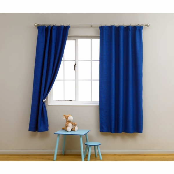 Cool Curtains in the nursery offer sun protection and charm