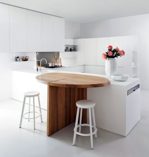 Minimalistic white kitchen with a dining area – by Elmar Studio