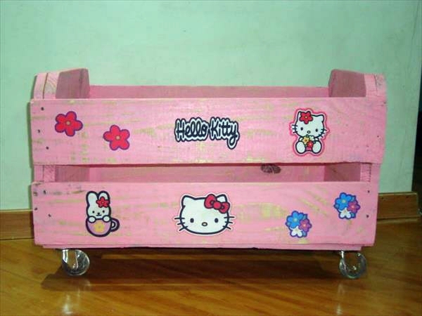 Pink storage box on wheels made of wood pallets
