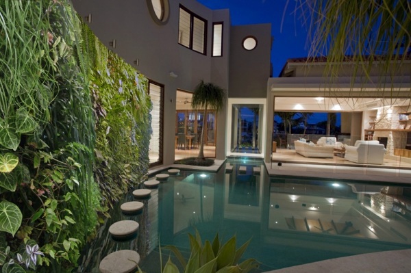 Vertical garden next to the swimming pool brings more green into your home Vertical garden next to the swimming pool brings more green into your home