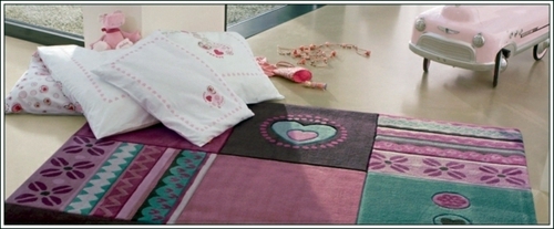 Beautiful designer carpet in the nursery of Esprit