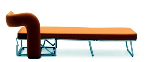 Orange armchair in single bed converted by Giulio Manzoni for Campeggi