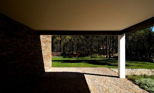 House with garden pond in the woods