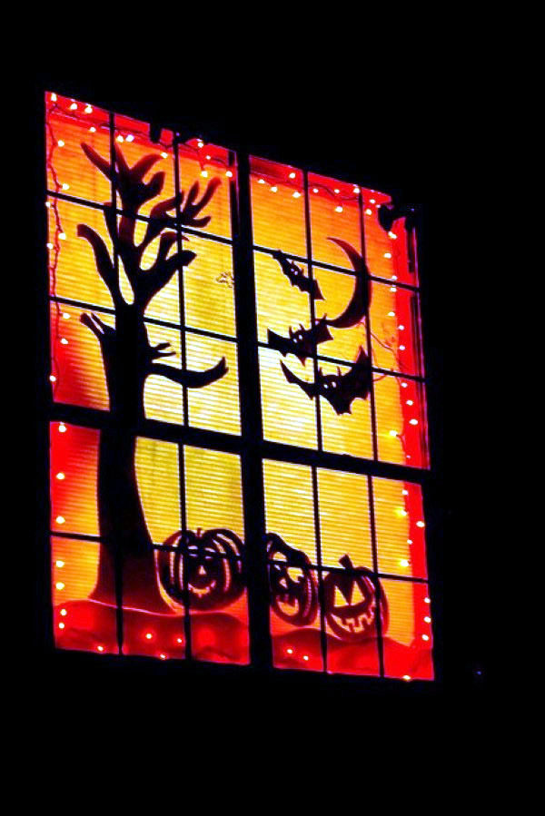 Ideas on how to decorate your windows with paper cutouts for Halloween