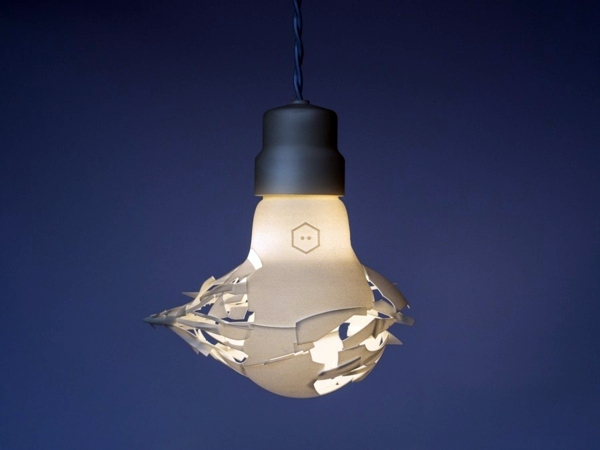 Broken designer lamps in the form of oversized light bulbs