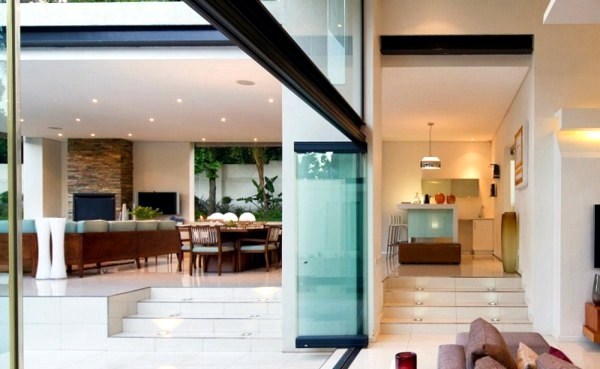 Contemporary prefab house in the Bauhaus style with glass facade and pool in the garden Contemporary prefab house in the Bauhaus style with glass facade and pool in the garden