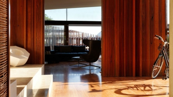 Modern residence with interior design from wood offers inviting lushness