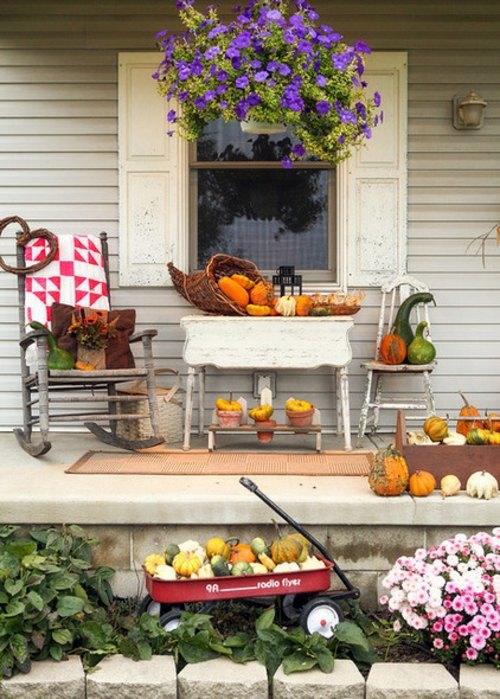 You have a penchant for hanging plants? - Hanging flower pots on the porch