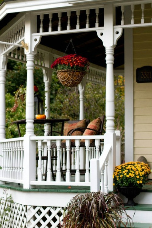 You have a penchant for hanging plants? - Hanging flower pots on the porch