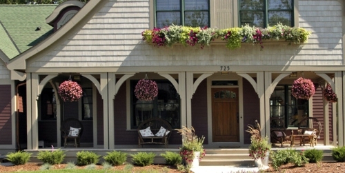 You have a penchant for hanging plants? - Hanging flower pots on the porch