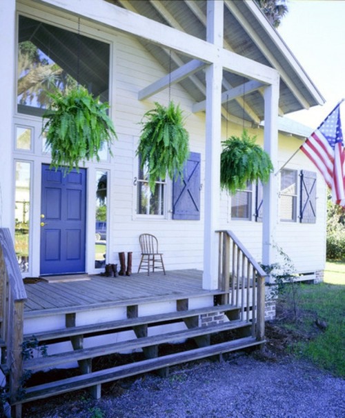 You have a penchant for hanging plants? - Hanging flower pots on the porch