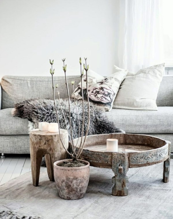 A wooden coffee table in the living room adds warmth and naturalness in