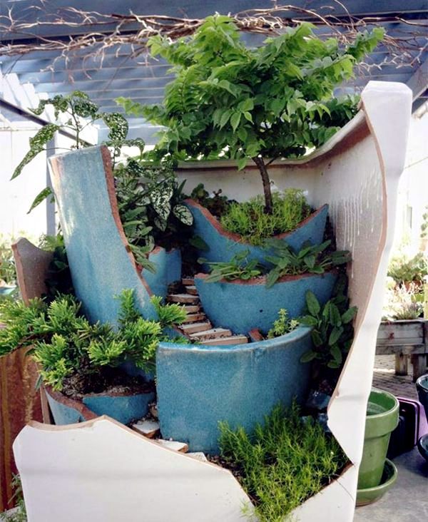 Creative Landscaping with broken plant pots