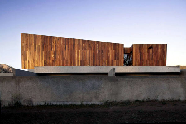 Wide modern house mix natural materials