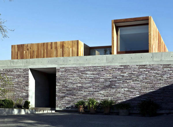 Wide modern house mix natural materials