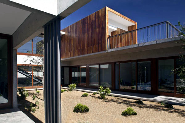 Wide modern house mix natural materials