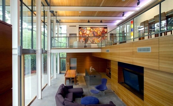 Modern house with windows and garden wall made of recycled glass