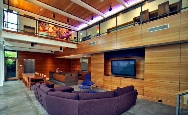 Modern house with windows and garden wall made of recycled glass