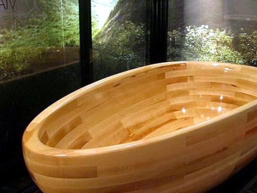 Attractive bathroom with bath from wood Attractive bathroom with bath from wood