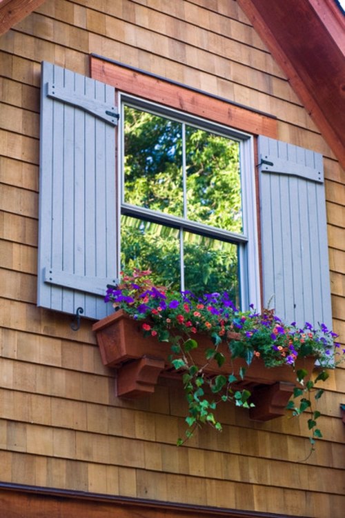 Flower boxes at the windows in different styles