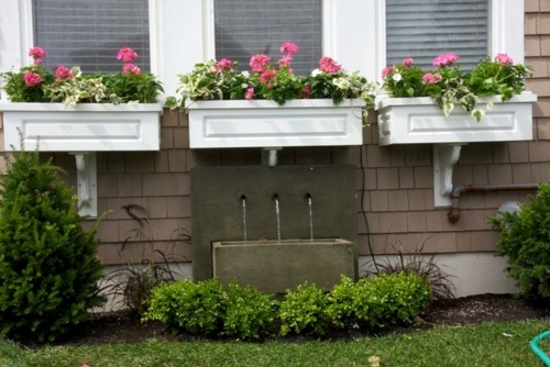 Flower boxes at the windows in different styles