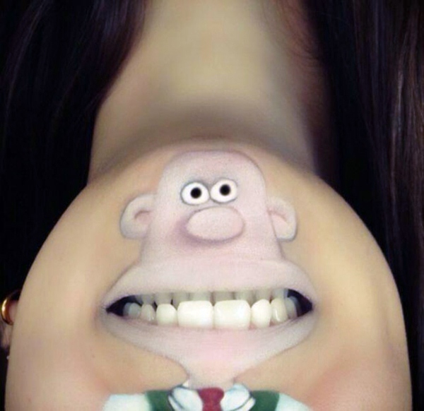 Creative make-up artist transforms her lips in cool cartoon characters