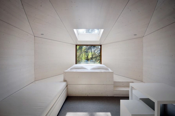 Two snake-like huts in the forest - a new term for tree house
