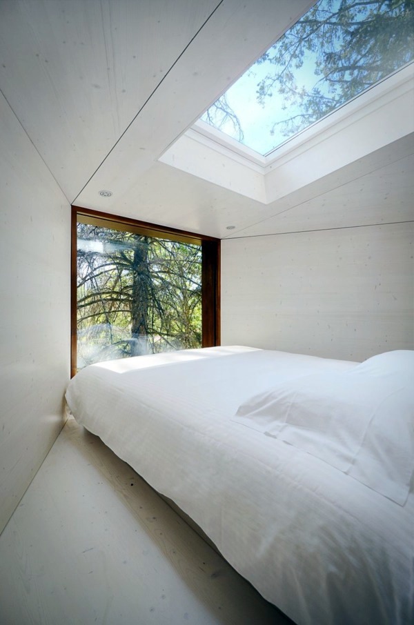 Two snake-like huts in the forest - a new term for tree house