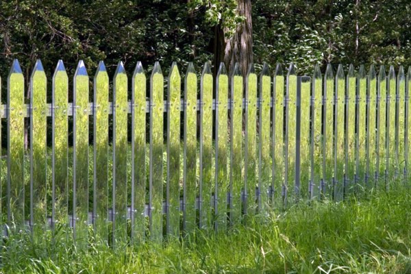 Mirror picket fence reflects the landscape