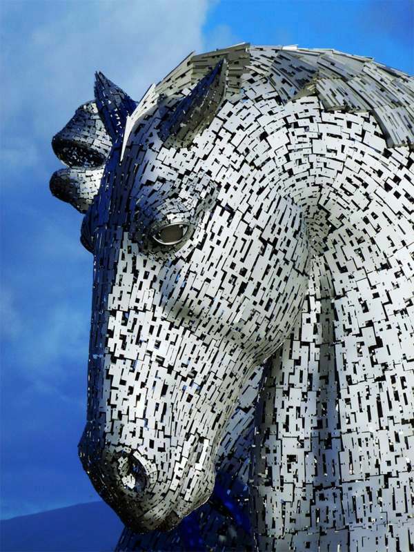 Huge Kelpies horse head sculptures tower over the Forth & Clyde Canal in Scotland