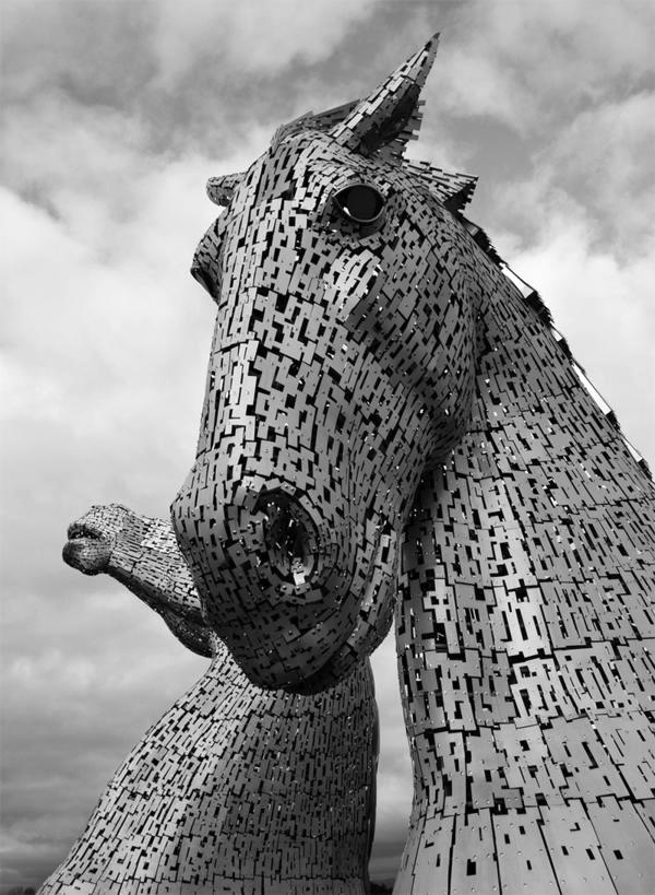 Huge Kelpies horse head sculptures tower over the Forth & Clyde Canal in Scotland