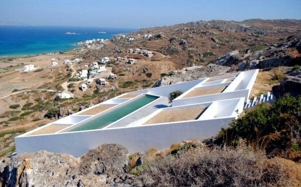 Modern cottage on the slopes of a rocky coast Modern cottage on the slopes of a rocky coast