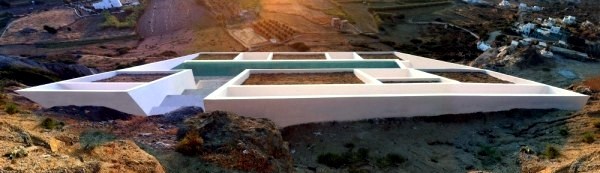 Modern cottage on the slopes of a rocky coast Modern cottage on the slopes of a rocky coast