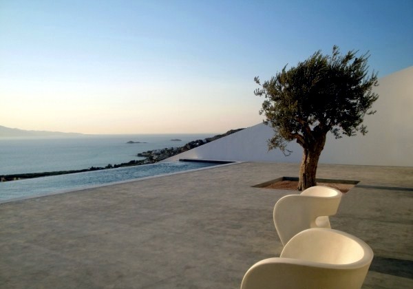 Modern cottage on the slopes of a rocky coast Modern cottage on the slopes of a rocky coast
