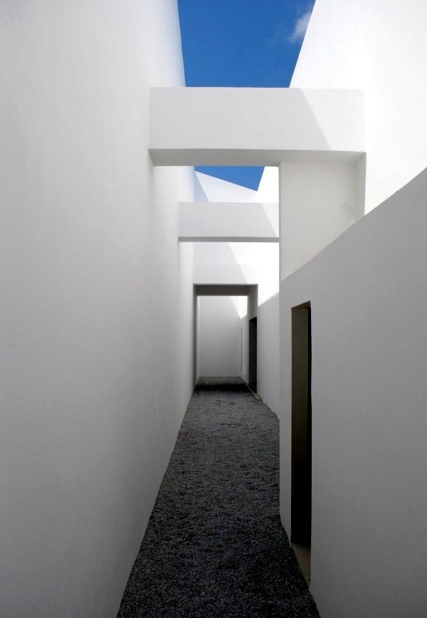 Modern cottage on the slopes of a rocky coast Modern cottage on the slopes of a rocky coast