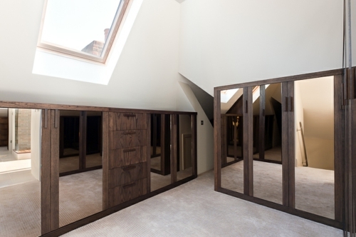 Bedroom in the attic with a large dressing room