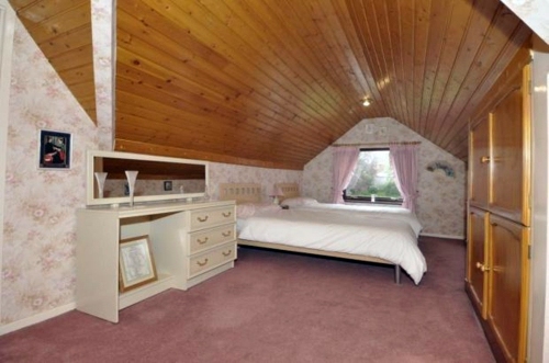 Bedroom in the attic with a large dressing room | Interior Design Ideas