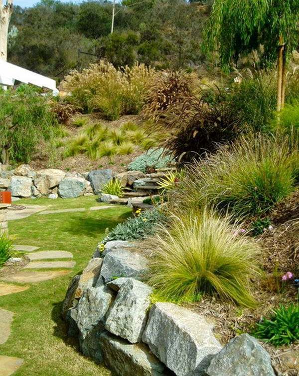 Install pebbles and river stones - beautiful landscape in the garden Install pebbles and river stones - beautiful landscape in the garden