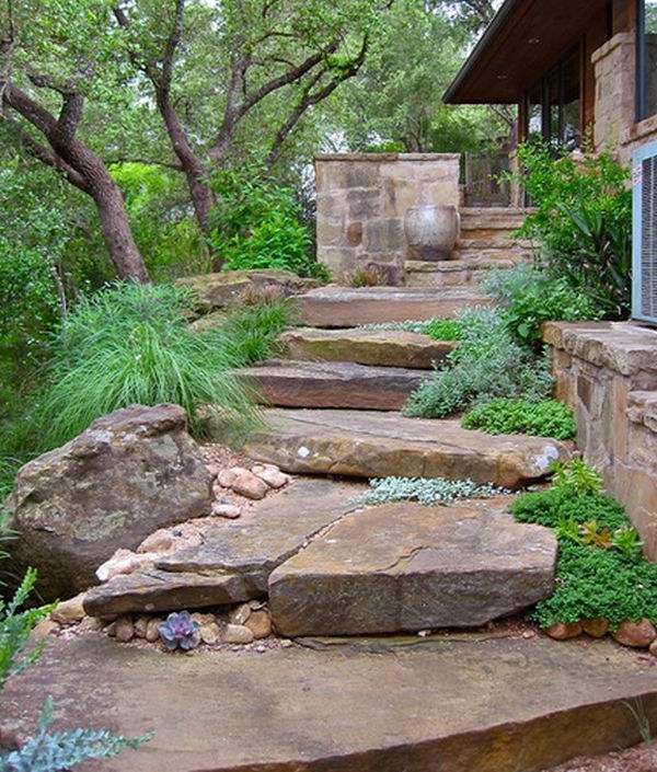 Install pebbles and river stones - beautiful landscape in the garden Install pebbles and river stones - beautiful landscape in the garden